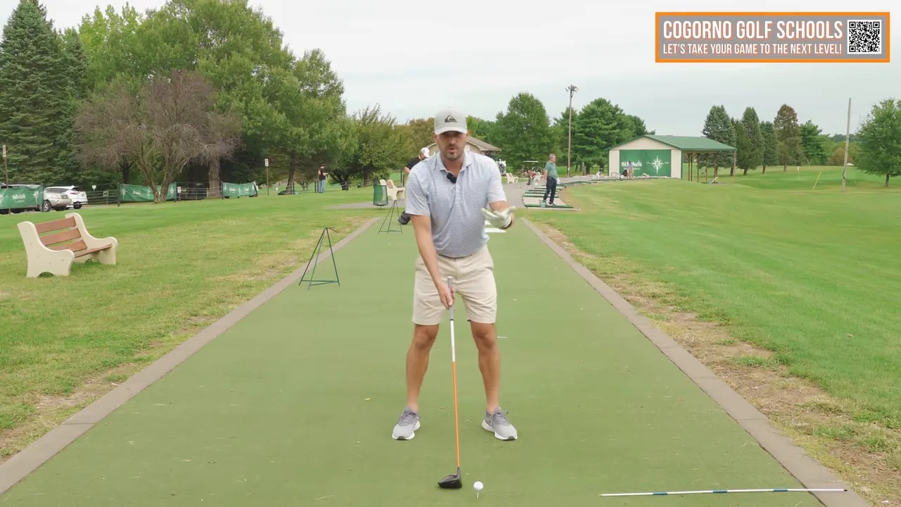 Golf coach demonstrating the toss and turn combo to let the club head pass your hands through impact