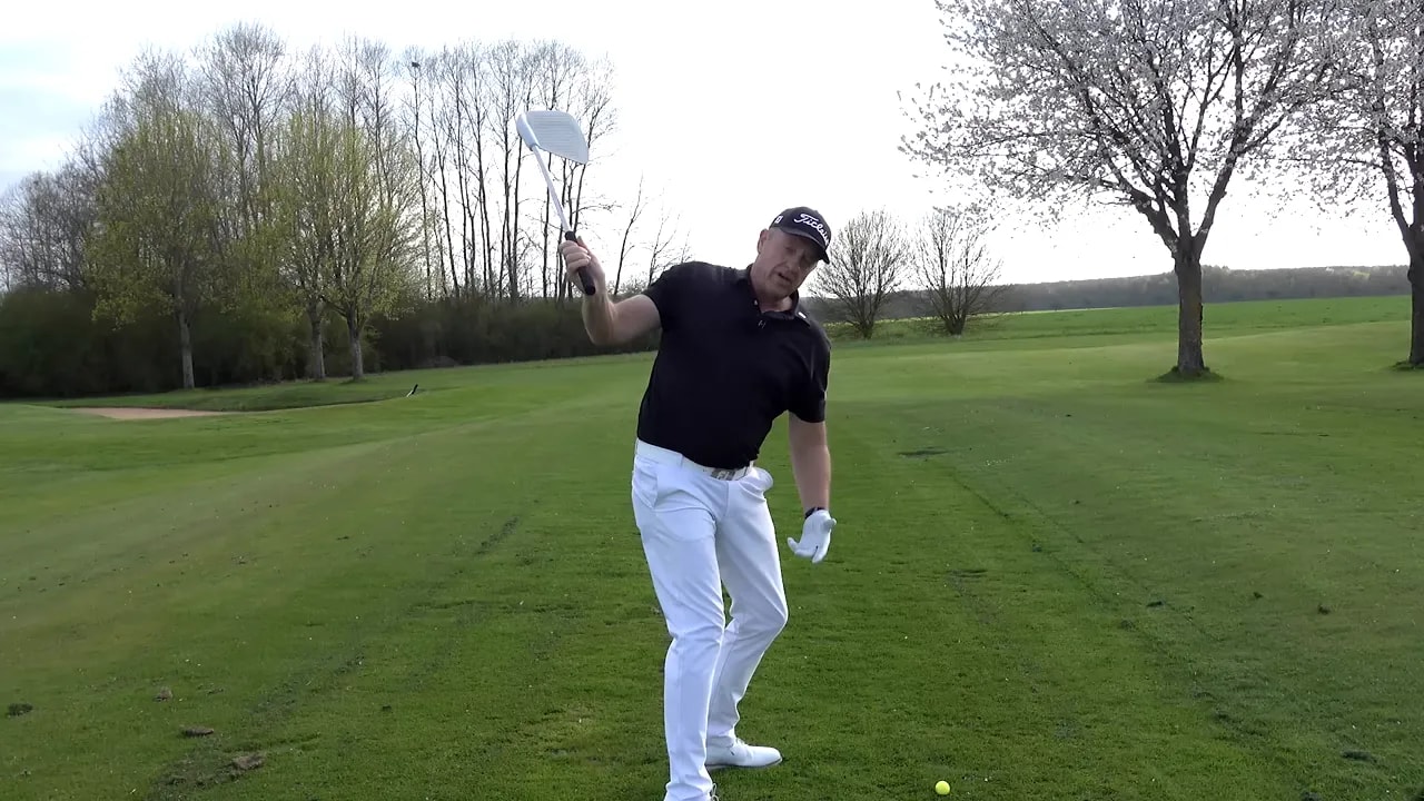 Rory McIlroy at setup demonstrating golf swing position before transition