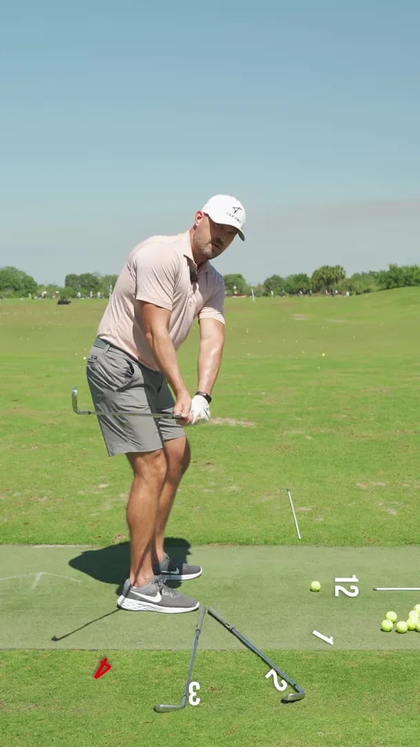 Clear view of golfer early takeaway with clock-face markers toward 2 o'clock