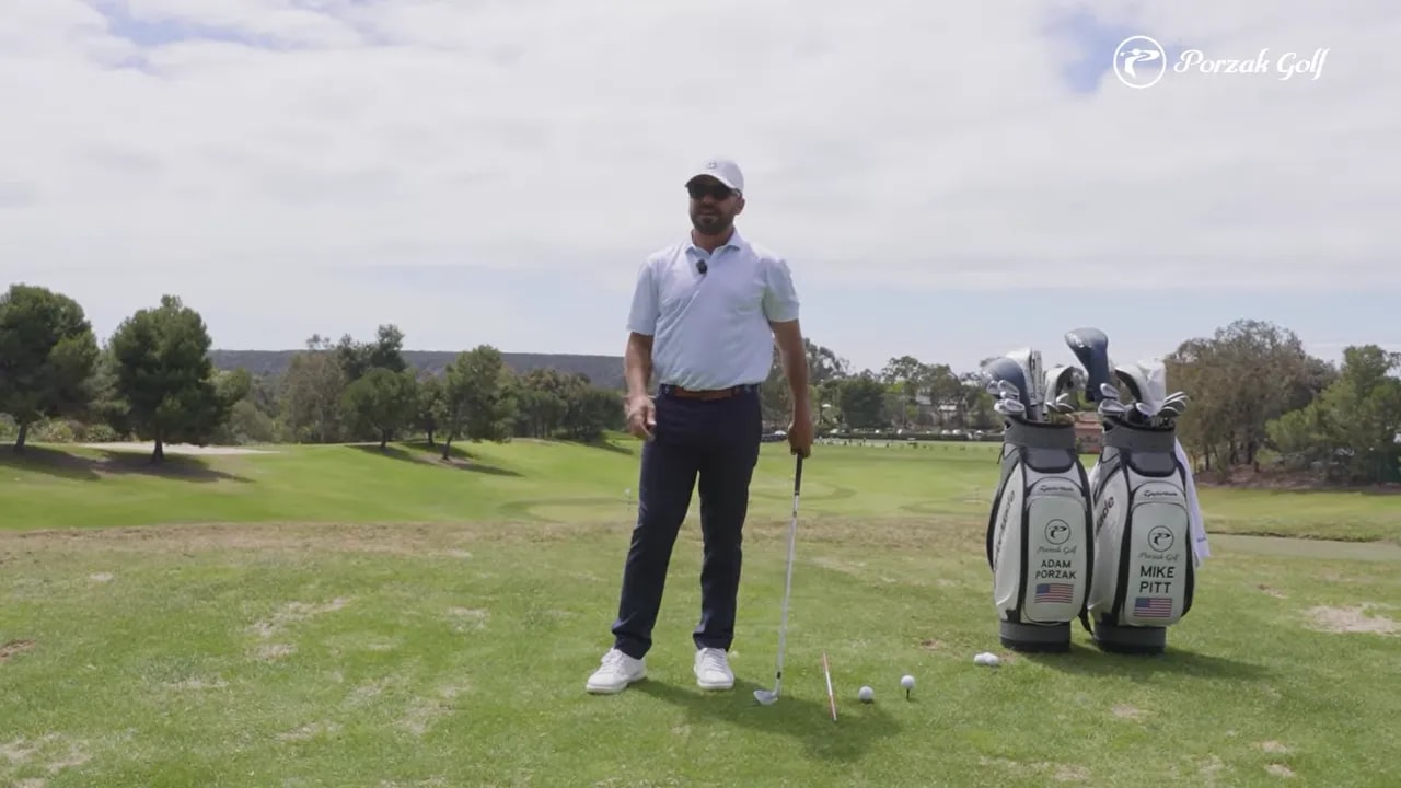 Golfer demonstrating drill setup on the practice range for early set position in driver vs iron takeaway