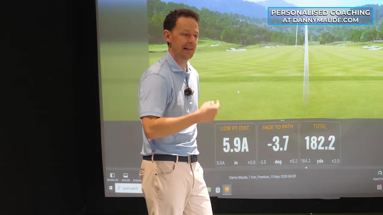 Golf coach explaining educated hands golf swing with simulator metrics visible