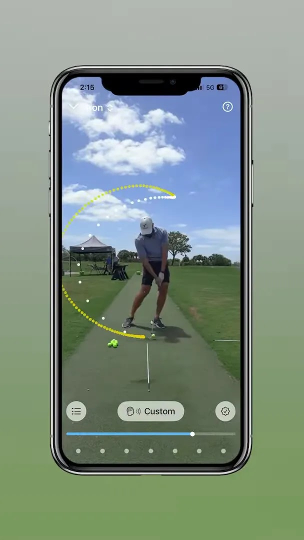Face-on phone video screenshot with highlighted trail knee and ball line checkpoint for the trail knee downswing drill