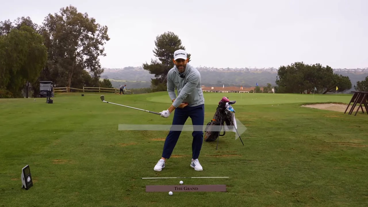 Golfer illustrating forward pressure sequence for compressing irons on the range