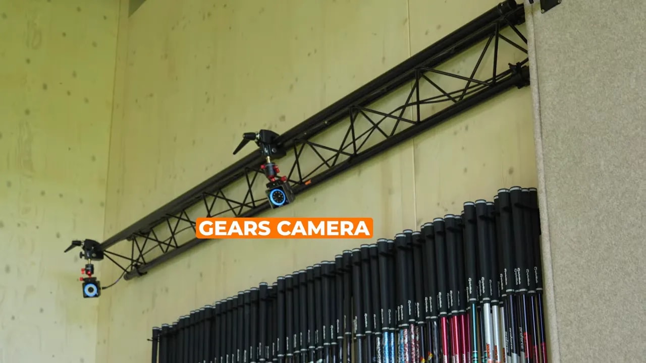 Gears camera rig installed in the ceiling over a TaylorMade Kingdom indoor fitting bay