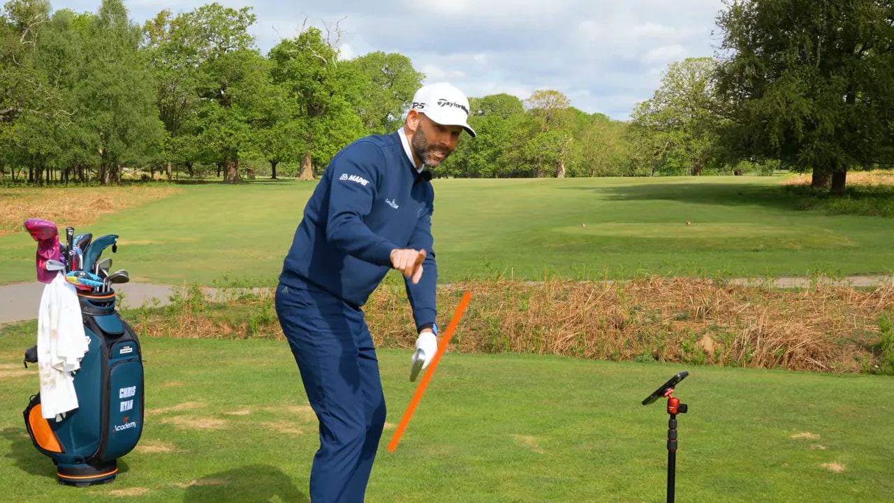 Delivery position checkpoint in golf showing hands and club path direction with overlay
