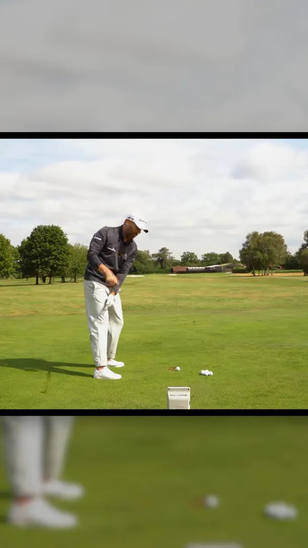 Golfer demonstrating arms beginning to work down while chest stays facing away in iron transition