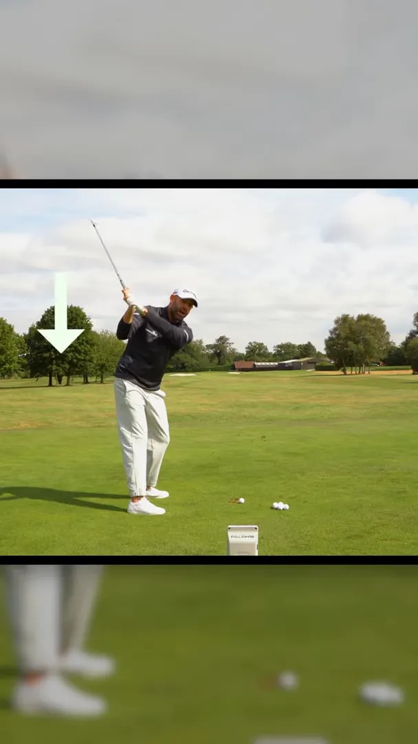 Golfer demonstrating arms dropping down and behind during iron transition for a draw