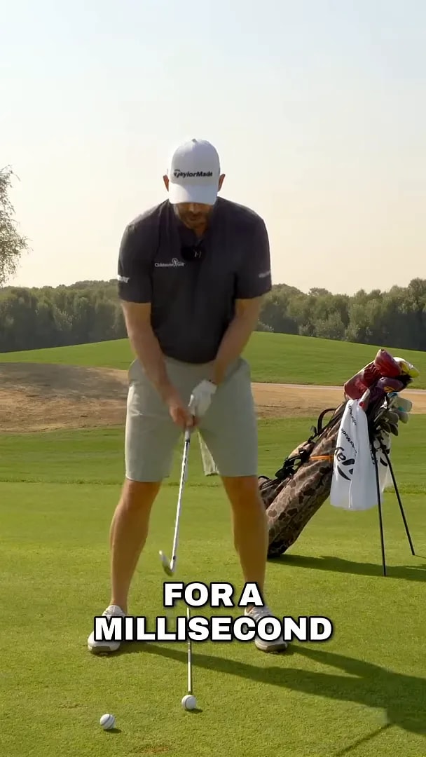 Golfer demonstrating a tiny lift-and-fall lead-foot feel to start the downswing in golf