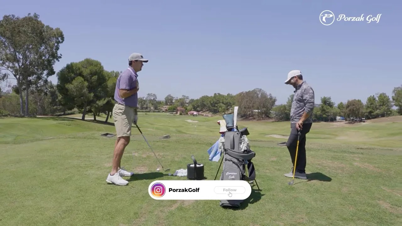 Golf instructor and student practicing on the range with equipment visible