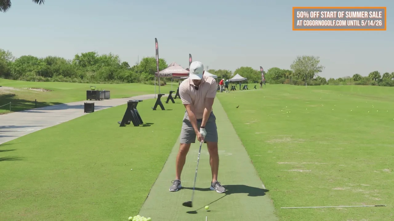 Golfer in halfway-back position demonstrating right shoulder retraction to create depth for golfers past 50