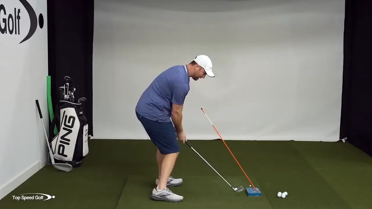 Golf downswing position with head centered and reduced sliding toward the target