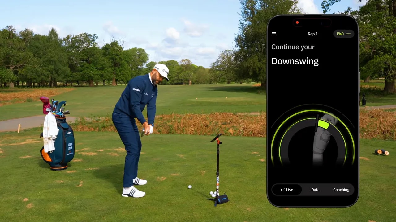 Golfer demonstrating the downswing while a smartphone screen overlays coaching data for the swing