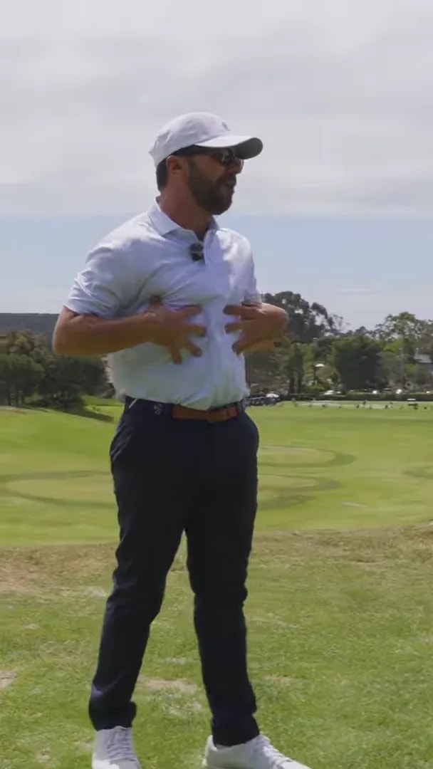Golfer demonstrating stable body turn with arms supporting rotation for better golf swing mechanics