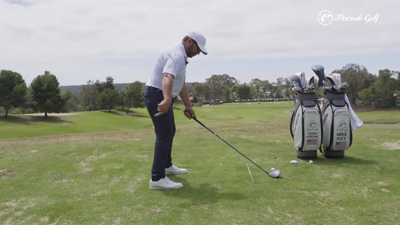 Golfer demonstrating takeaway progress toward early set position for driver vs iron timing