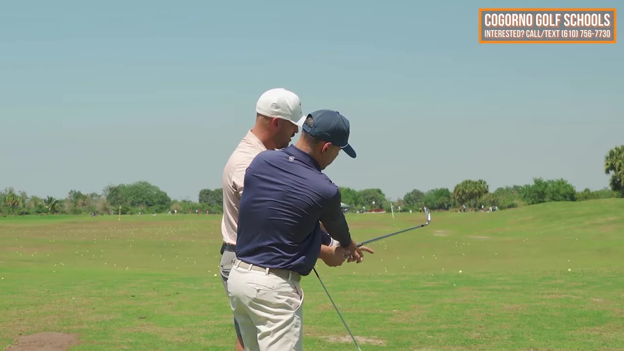 Golf through-swing finish showing extension for over-the-top golf swing fix