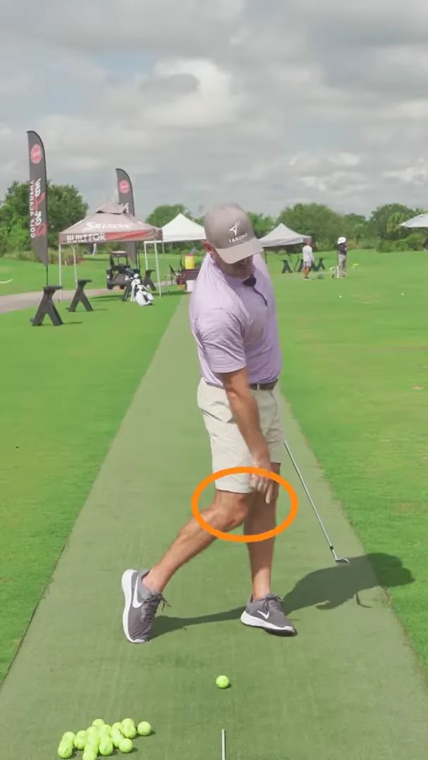 Downswing checkpoint for trail knee downswing drill showing trail knee leading toward the lead knee