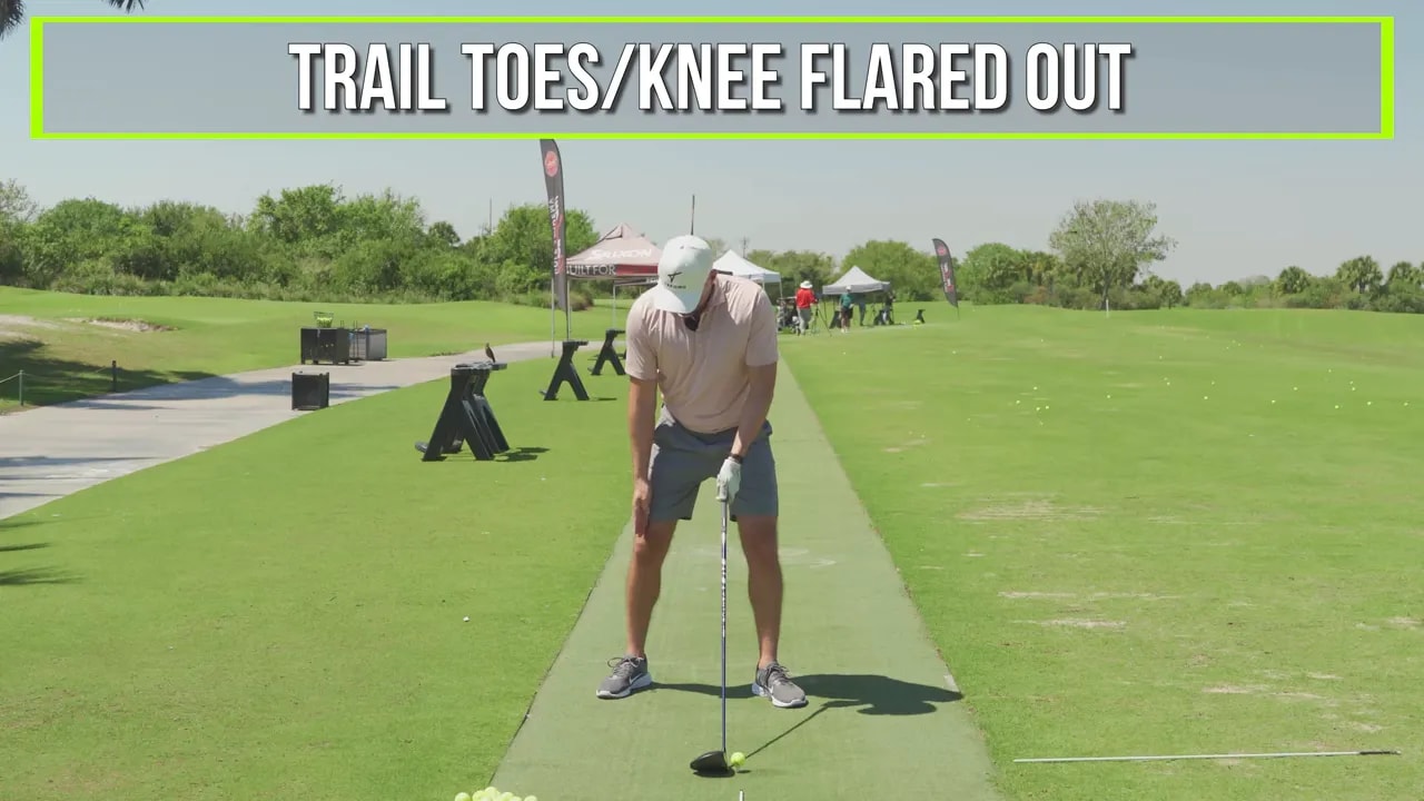 Golf address setup showing trail toes and trail knee flared outward for better hip rotation