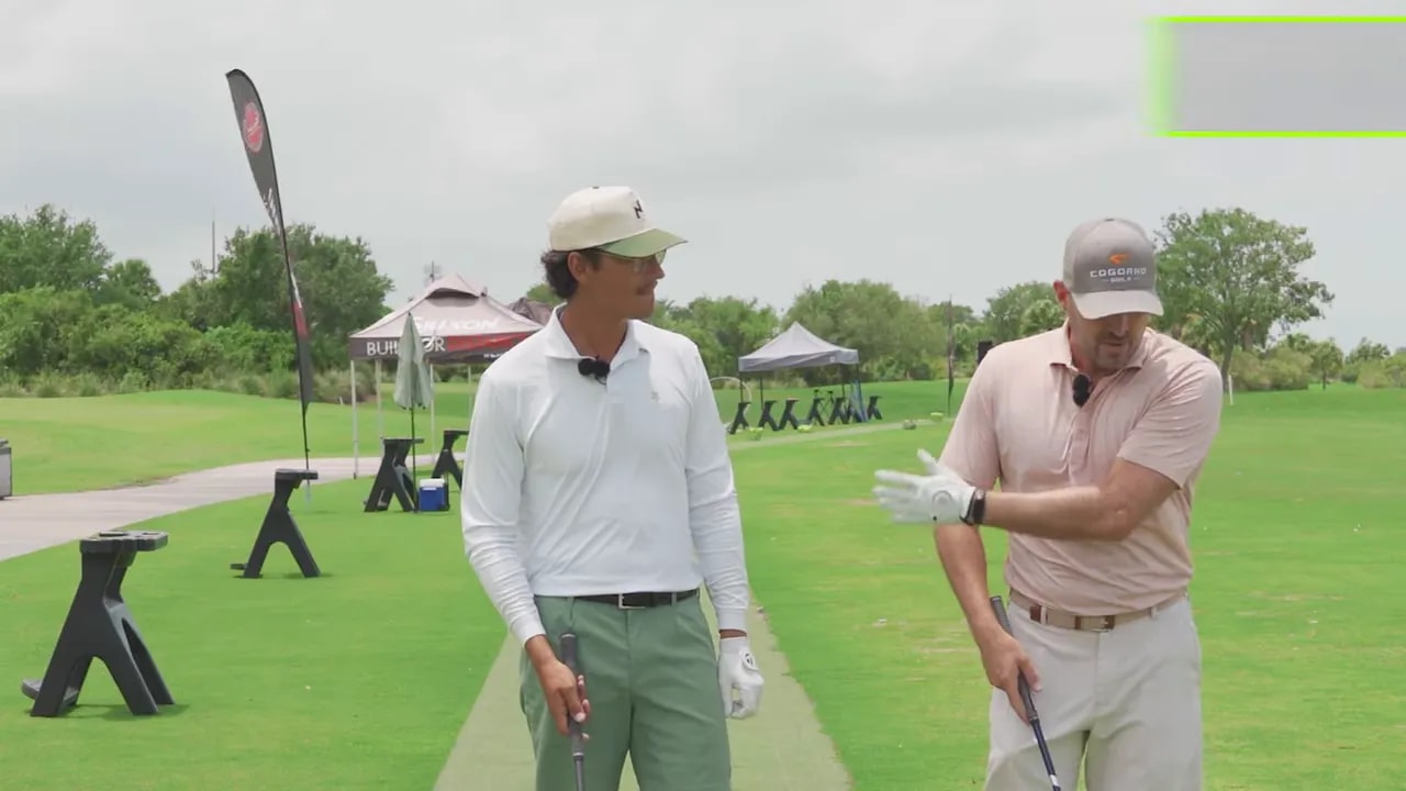 Two golfers standing on range with on screen text that says arms sling off body