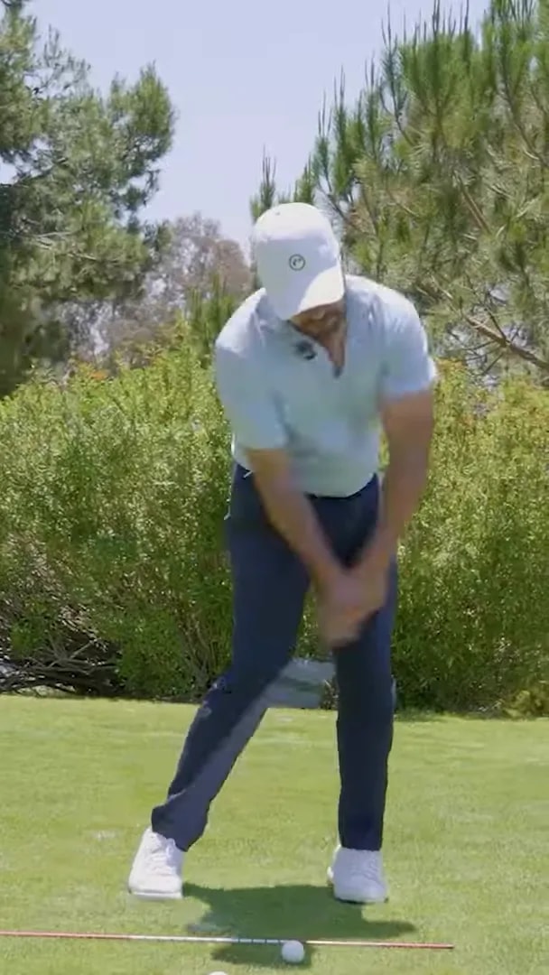golfer in balanced follow-through with chest turned toward target and trail foot up