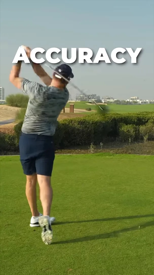 Golfer finishing a driver swing with the word DISTANCE on screen