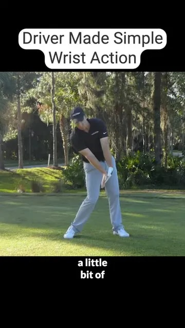 golfer demonstrating impact alignments with hands ahead and club shaft angled slightly forward