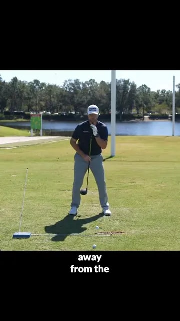 golfer demonstrating slight spine tilt away from target while holding a driver