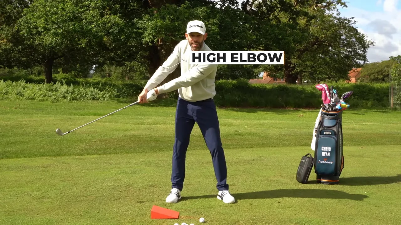 golfer at halfway down with on screen text reading high elbow