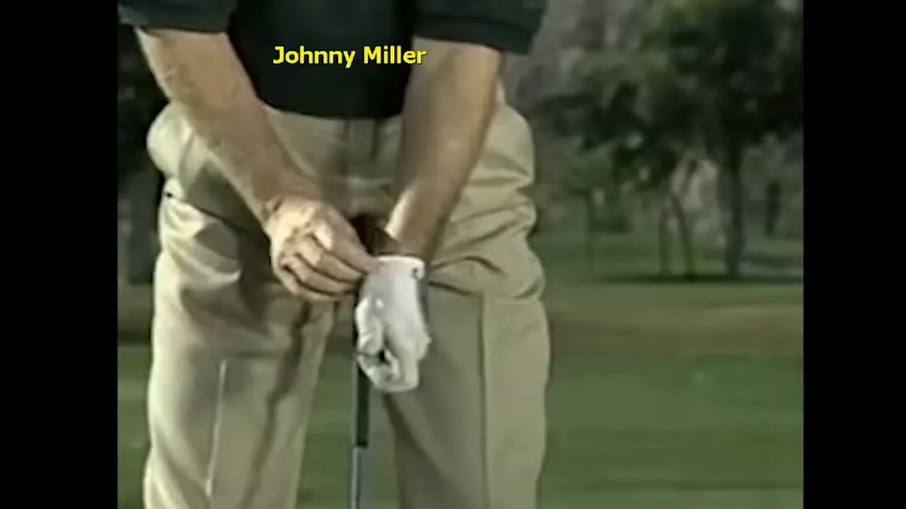 close up of hands on club labeled Johnny Miller during wrist motion demonstration