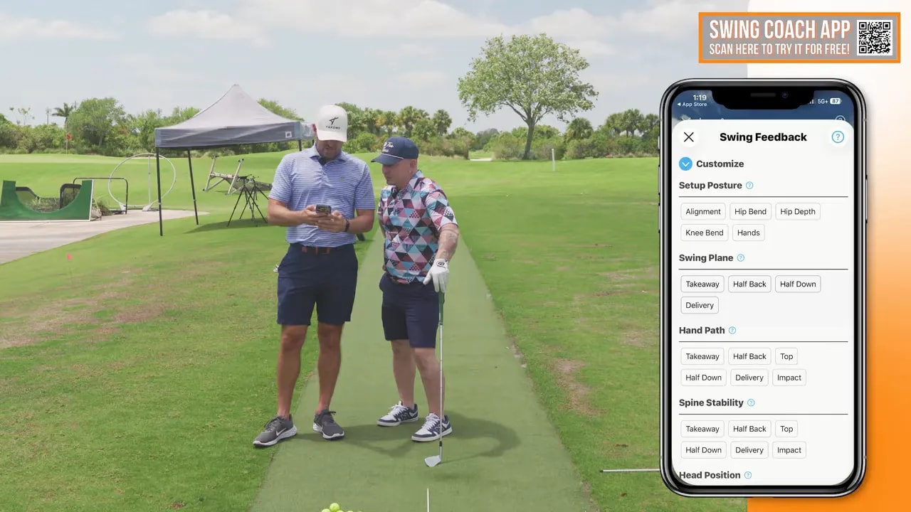 Golfer and coach standing on a range beside a phone screen showing swing analysis settings