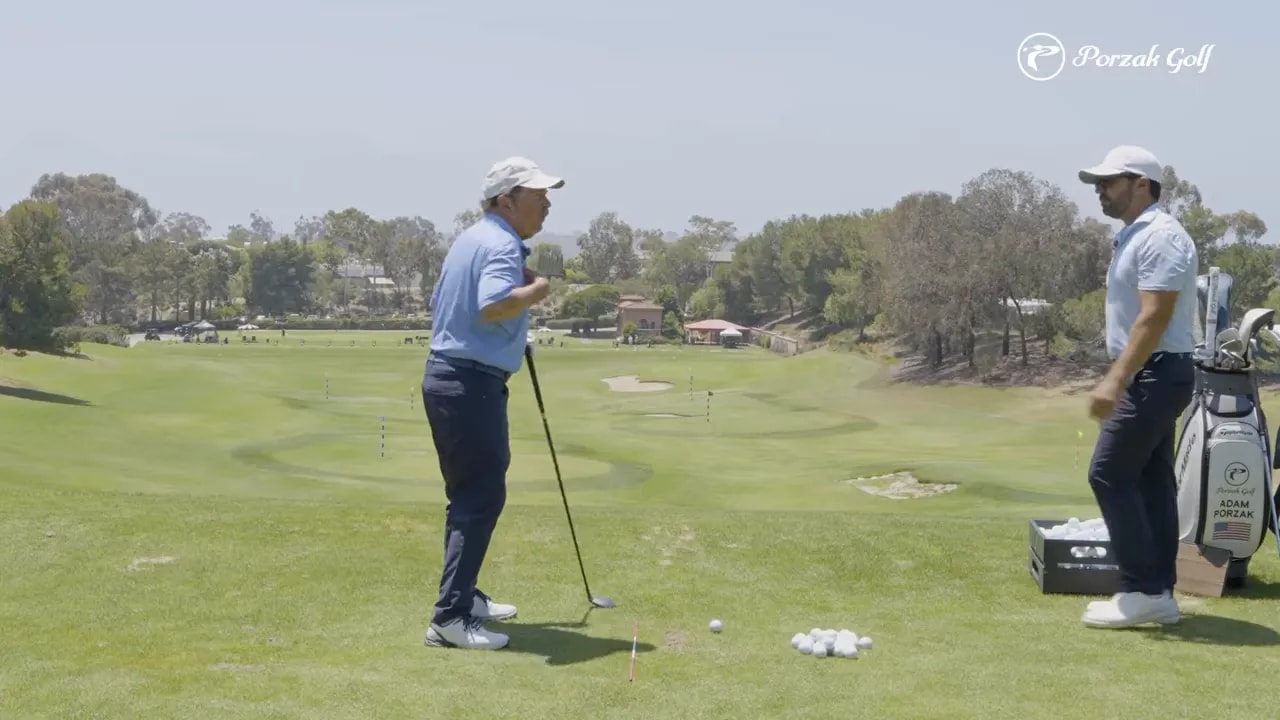 golfer demonstrating shoulder turn with trail arm extended while holding a club