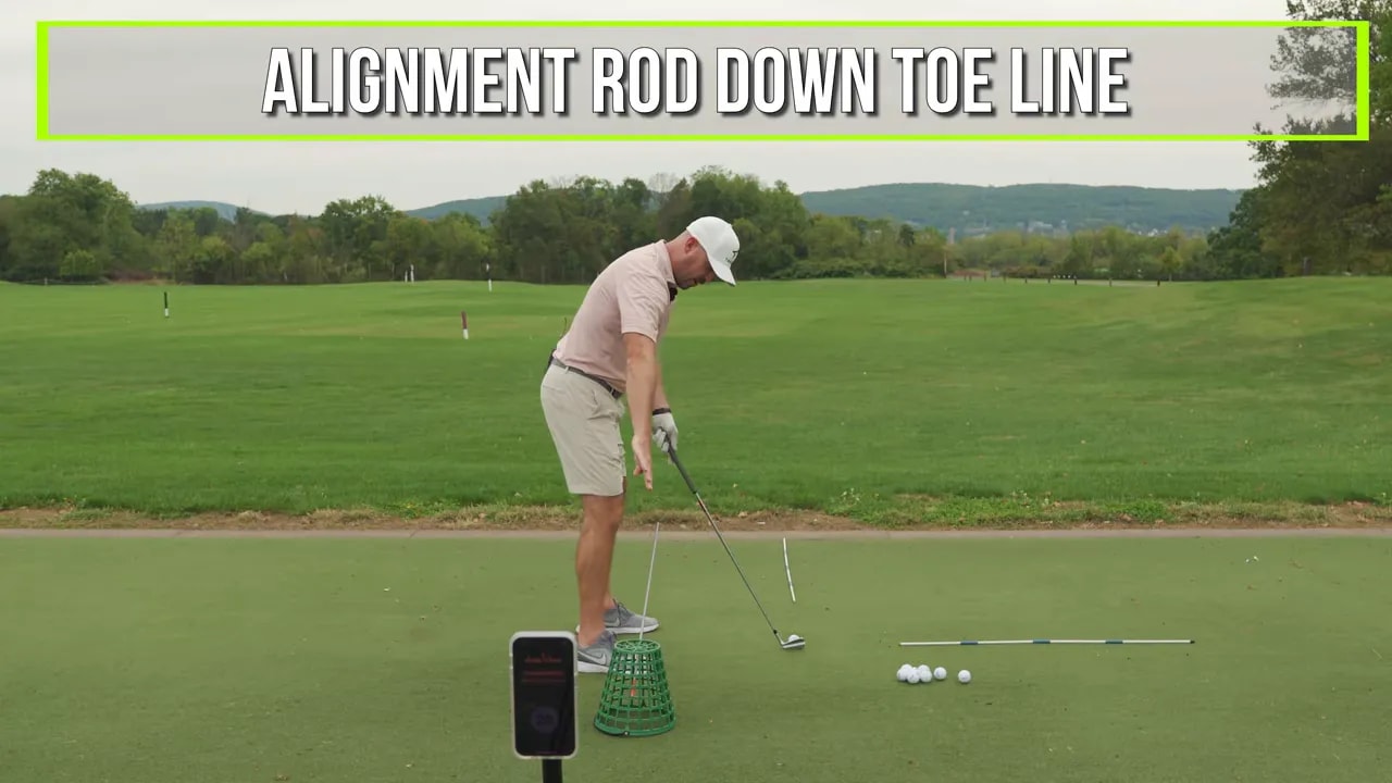 Side view of setup with alignment rod down toe line and on screen text