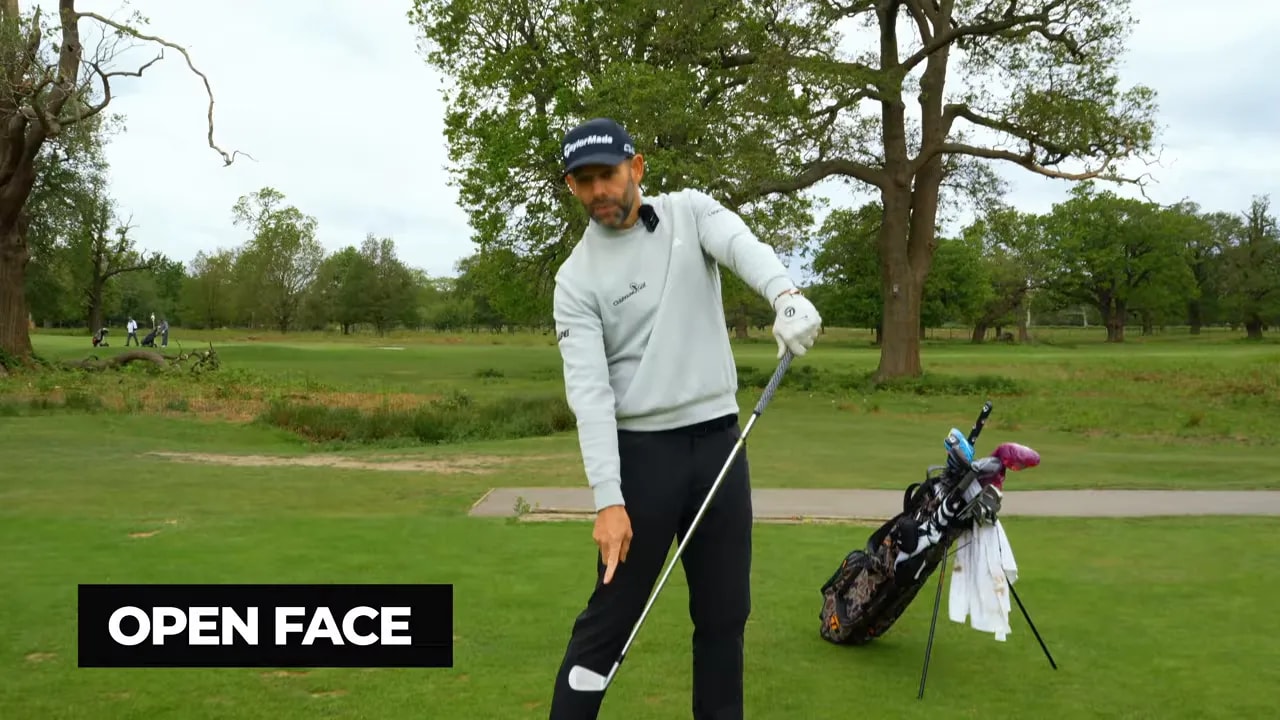 Golfer demonstrating impact bag strike with open face label