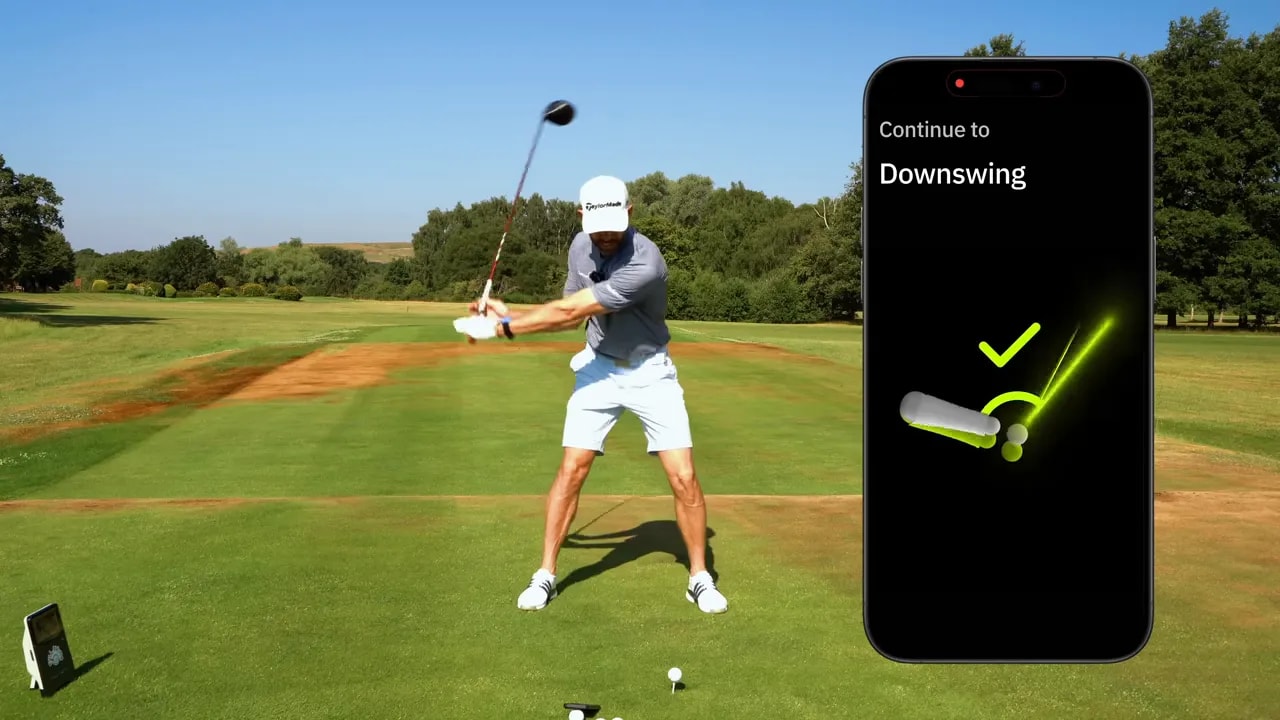 Golfer in downswing beside a green phone display reading In range