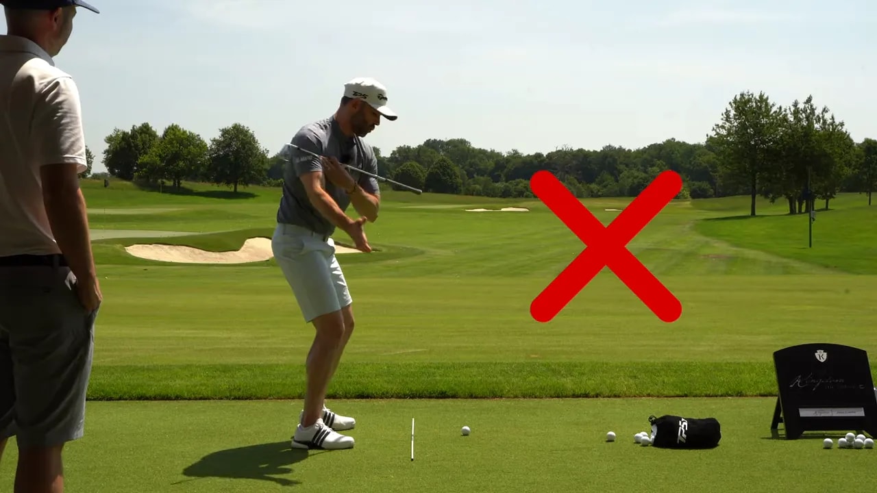 Golfer demonstrating a level shoulder turn with red cross graphic
