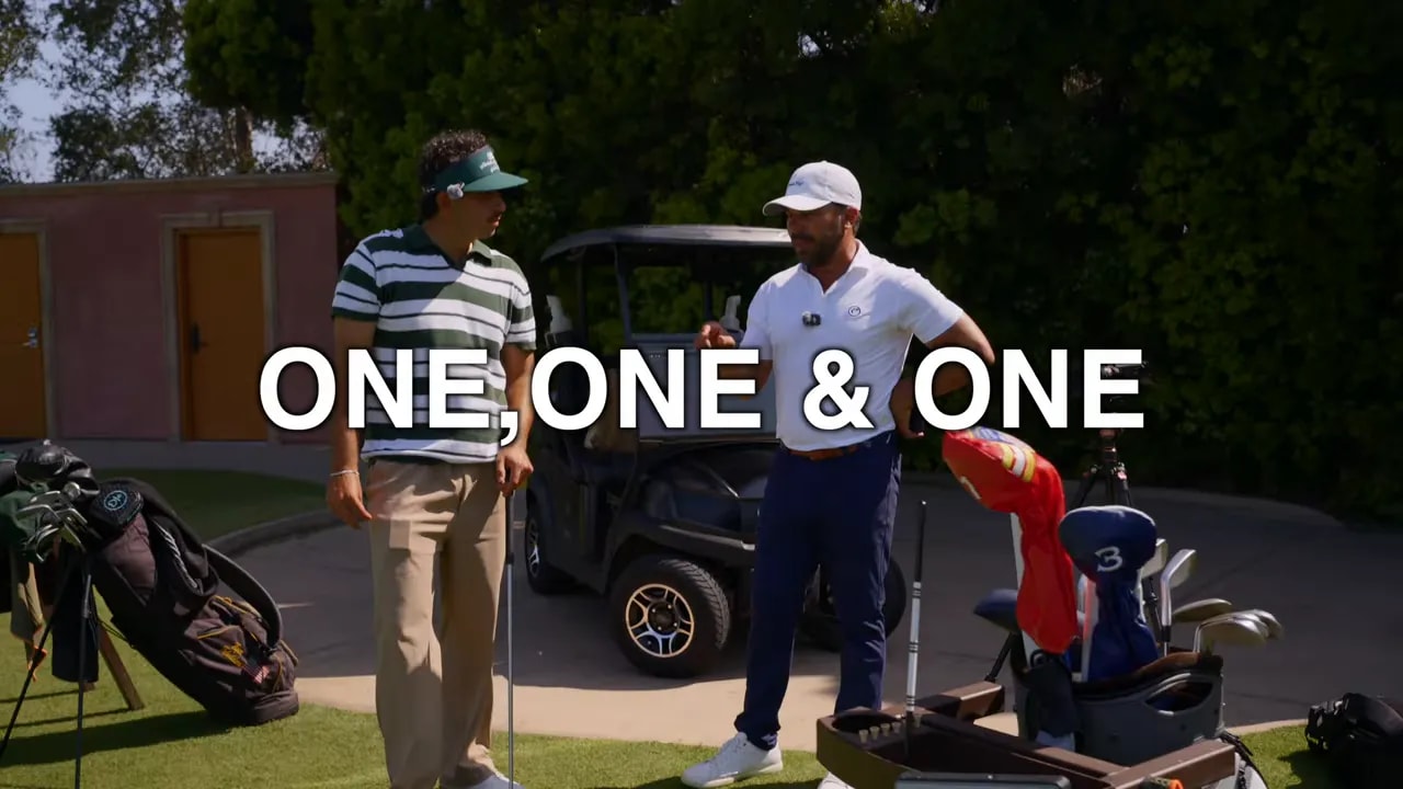 One one and one text over golfers standing beside golf bags