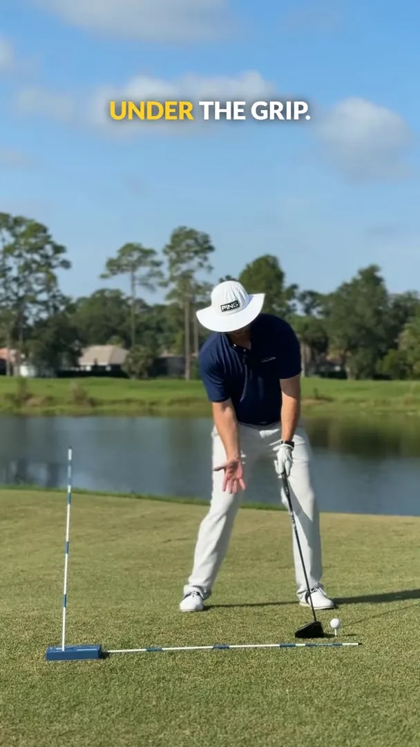 golfer placing right hand more underneath the driver grip at address