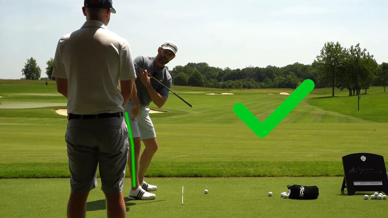 Golfer at top of backswing with green check mark and highlighted trail leg