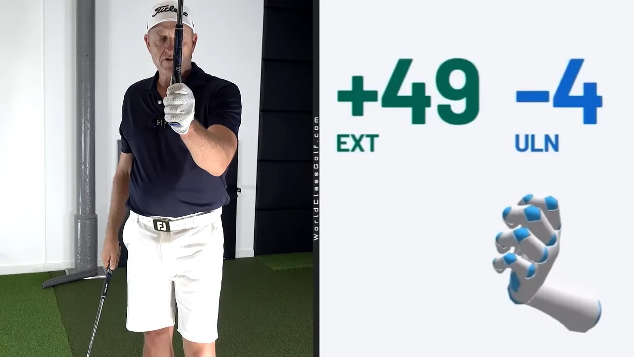 instructor holding club upright beside hand data graphic showing plus 49 ext and minus 4 uln