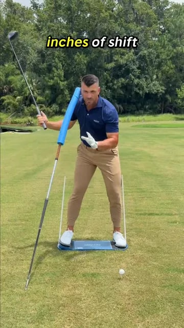 Golfer demonstrating a lateral shift toward the target before hip rotation